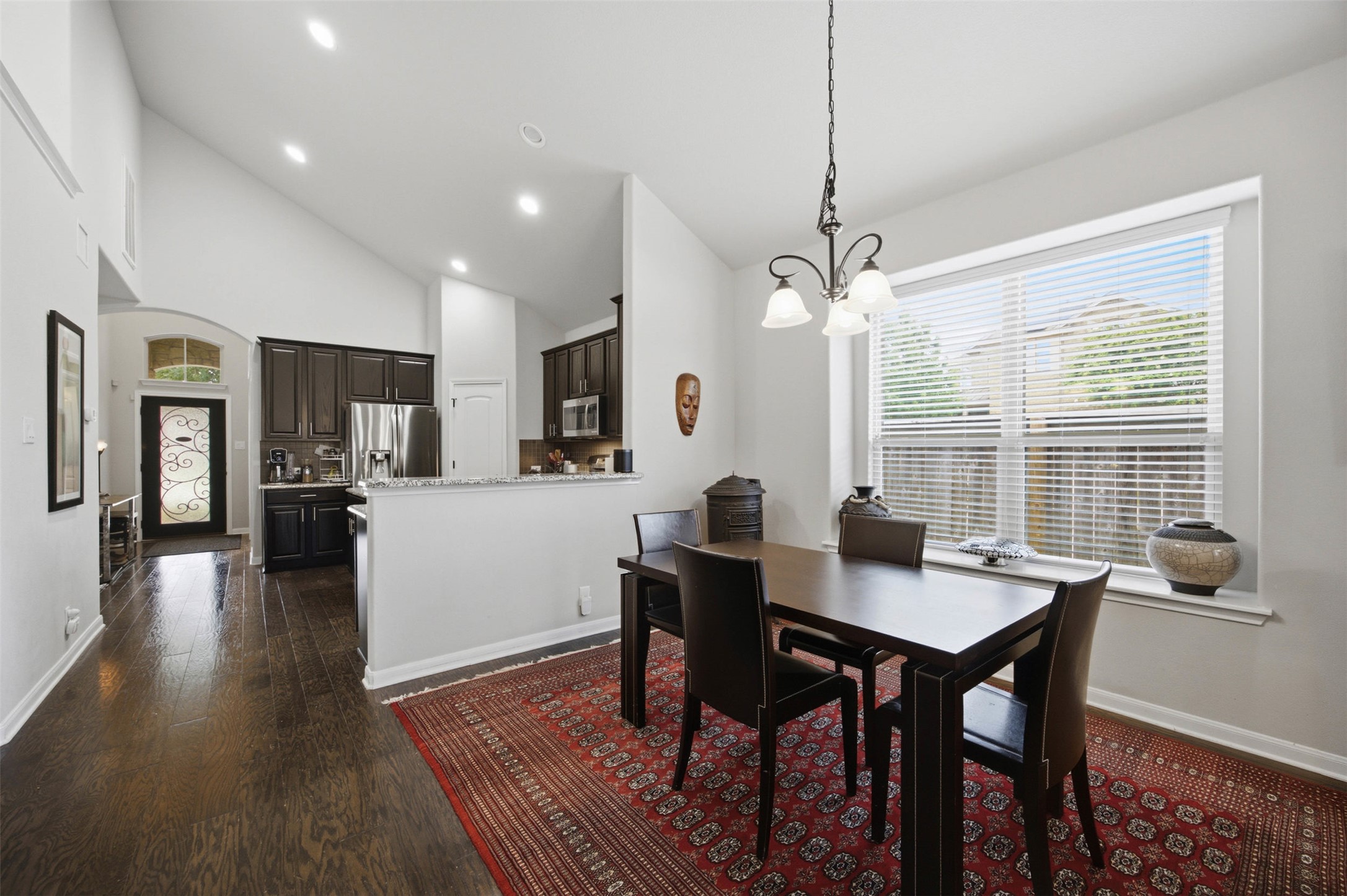 328 Rock Mill Loop Georgetown, TX 78626 - Photo 10 of 29 The dining area flows naturally from the kitchen, perfect for hosting family and friends. Large windows bring in plenty of natural light. It creates an inviting space for everyday meals or special occasions.
