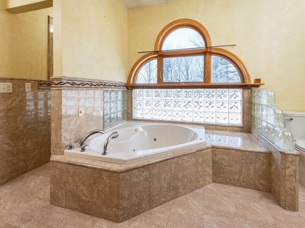 4 Thurston Hill Road Rutland, MA 01543 - Photo 17 of 35 a bath tub sitting next to a shower