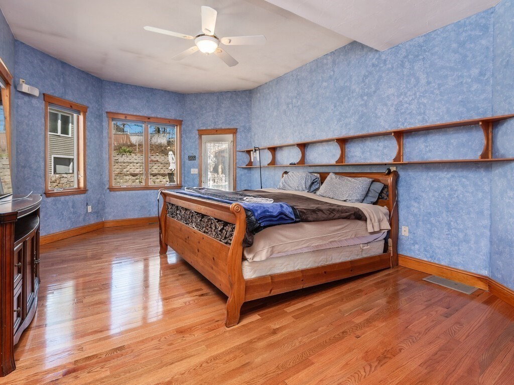 4 Thurston Hill Road Rutland, MA 01543 - Photo 19 of 35 a bedroom with a bed and large windows
