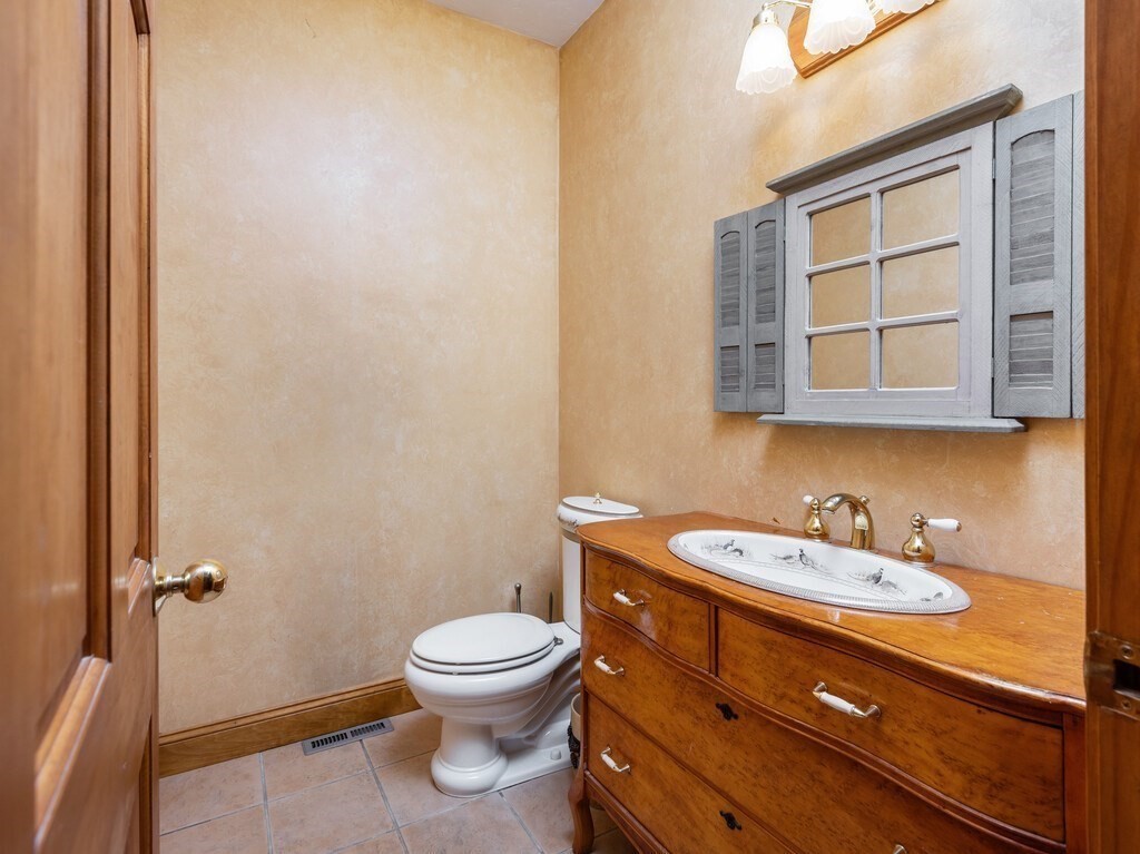 4 Thurston Hill Road Rutland, MA 01543 - Photo 23 of 35 a bathroom with a toilet sink and mirror
