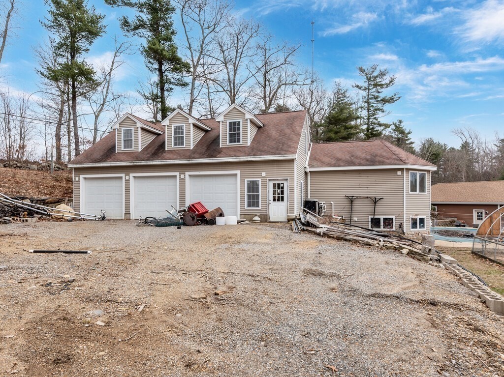 4 Thurston Hill Road Rutland, MA 01543 - Photo 32 of 35 a front view of a house with a yard and garage