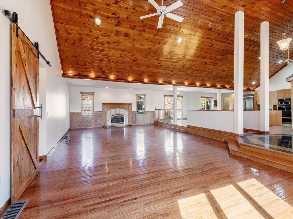 4 Thurston Hill Road Rutland, MA 01543 - Photo 10 of 35 a view of a patio with wooden floor and a yard