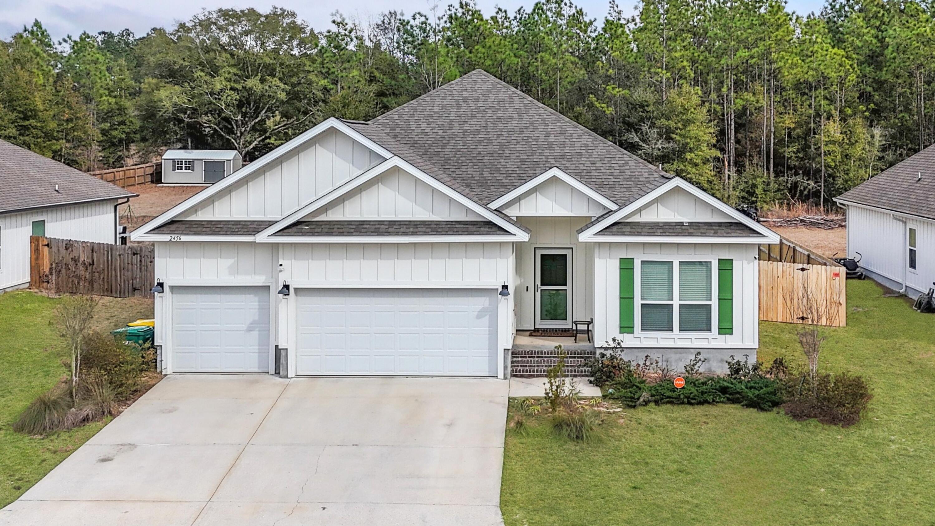 2456 Dakota Way Crestview, FL 32536 - Photo 1 of 38 a front view of a house with a yard and garage
