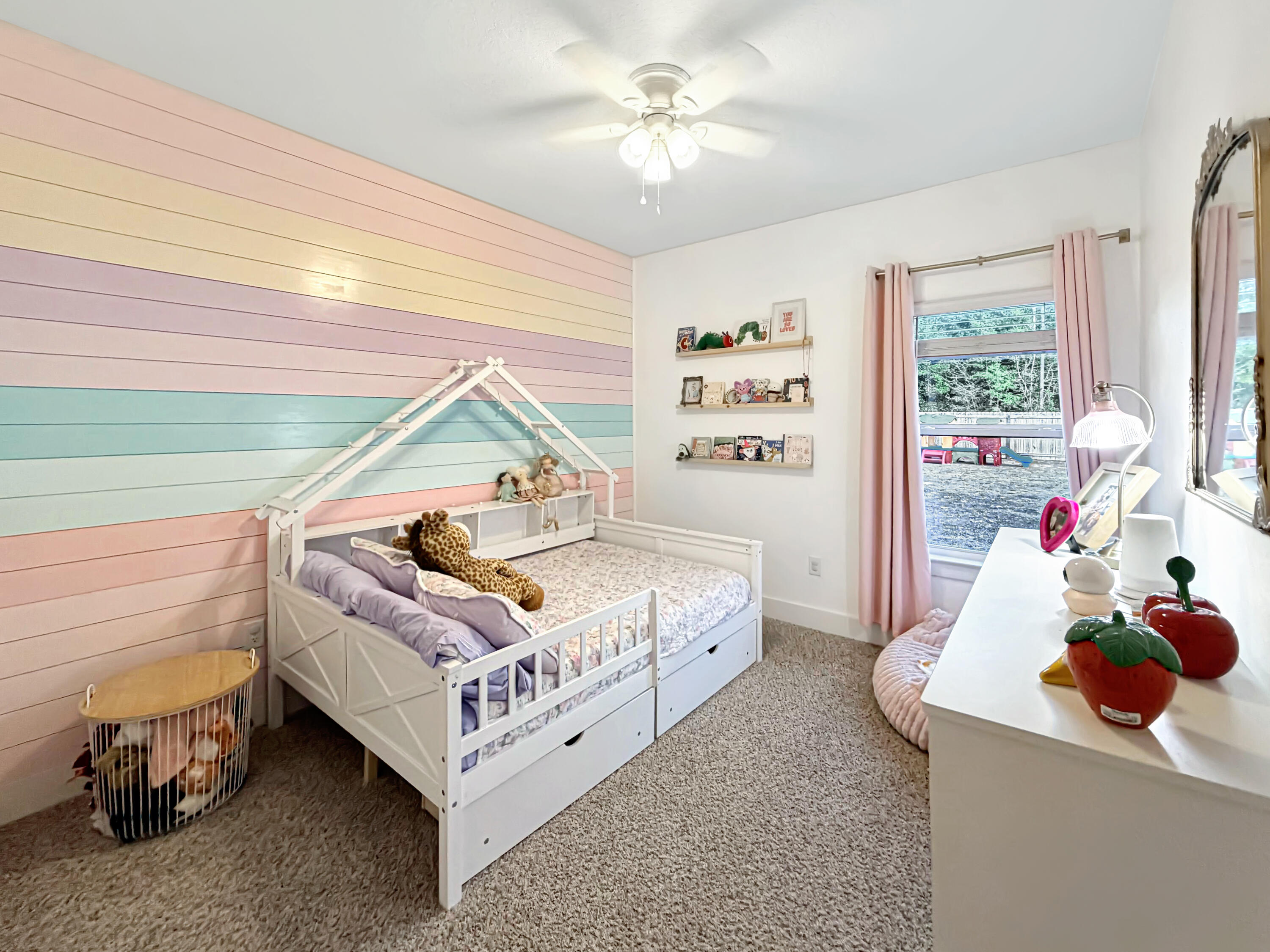 2456 Dakota Way Crestview, FL 32536 - Photo 12 of 38 a bedroom with a bed and a chandelier