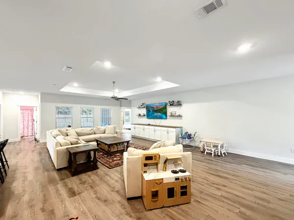 a room with a wooden floor and a table