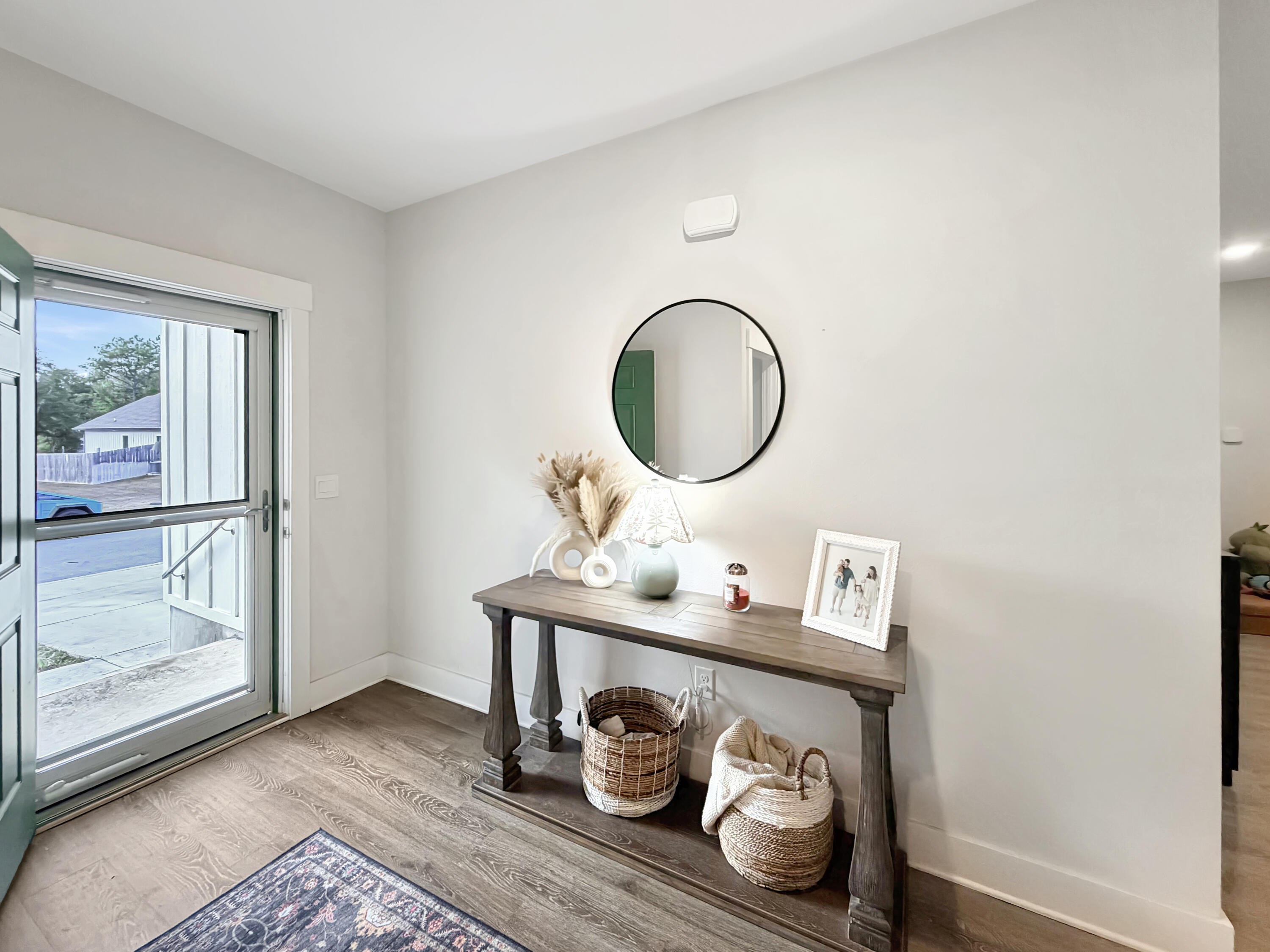 2456 Dakota Way Crestview, FL 32536 - Photo 18 of 38 a room with a wooden floor and a table