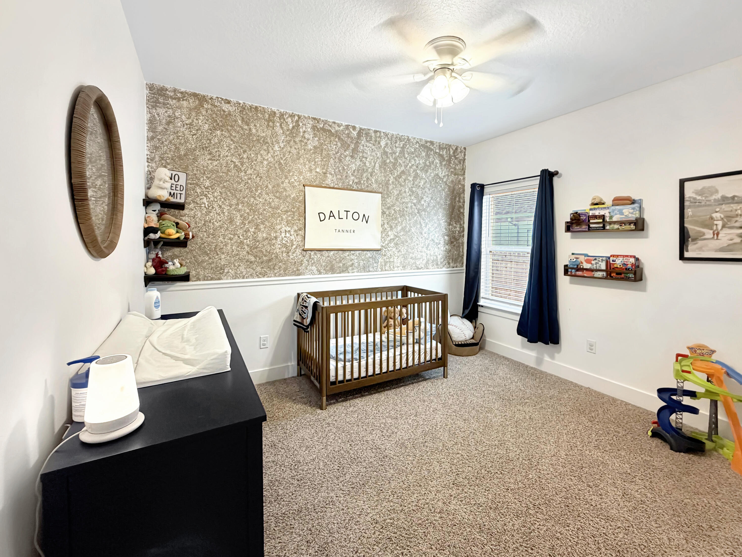 2456 Dakota Way Crestview, FL 32536 - Photo 24 of 38 a bedroom with a bed and a chandelier