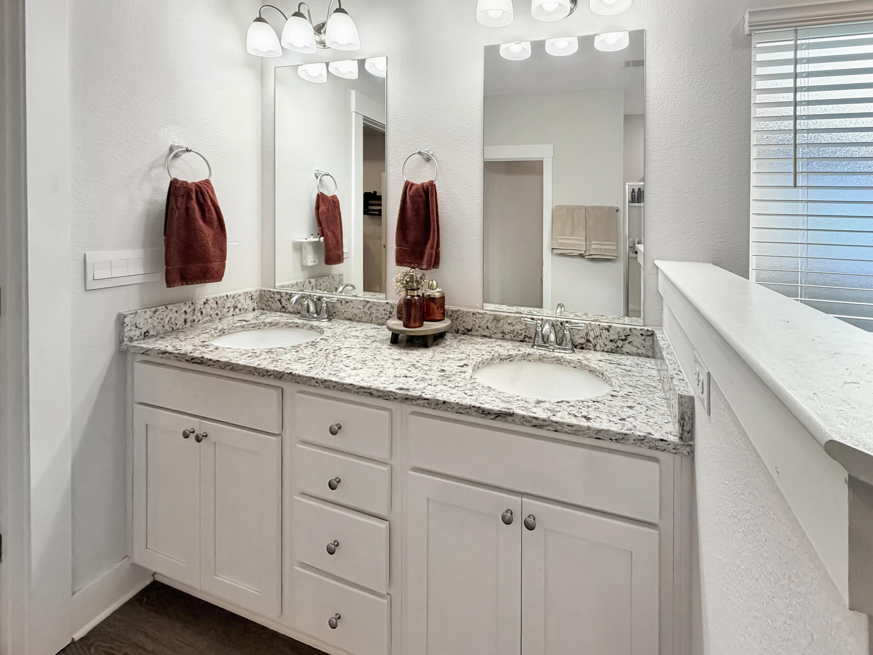 2456 Dakota Way Crestview, FL 32536 - Photo 26 of 38 a bathroom with a granite countertop double vanity sink and a mirror