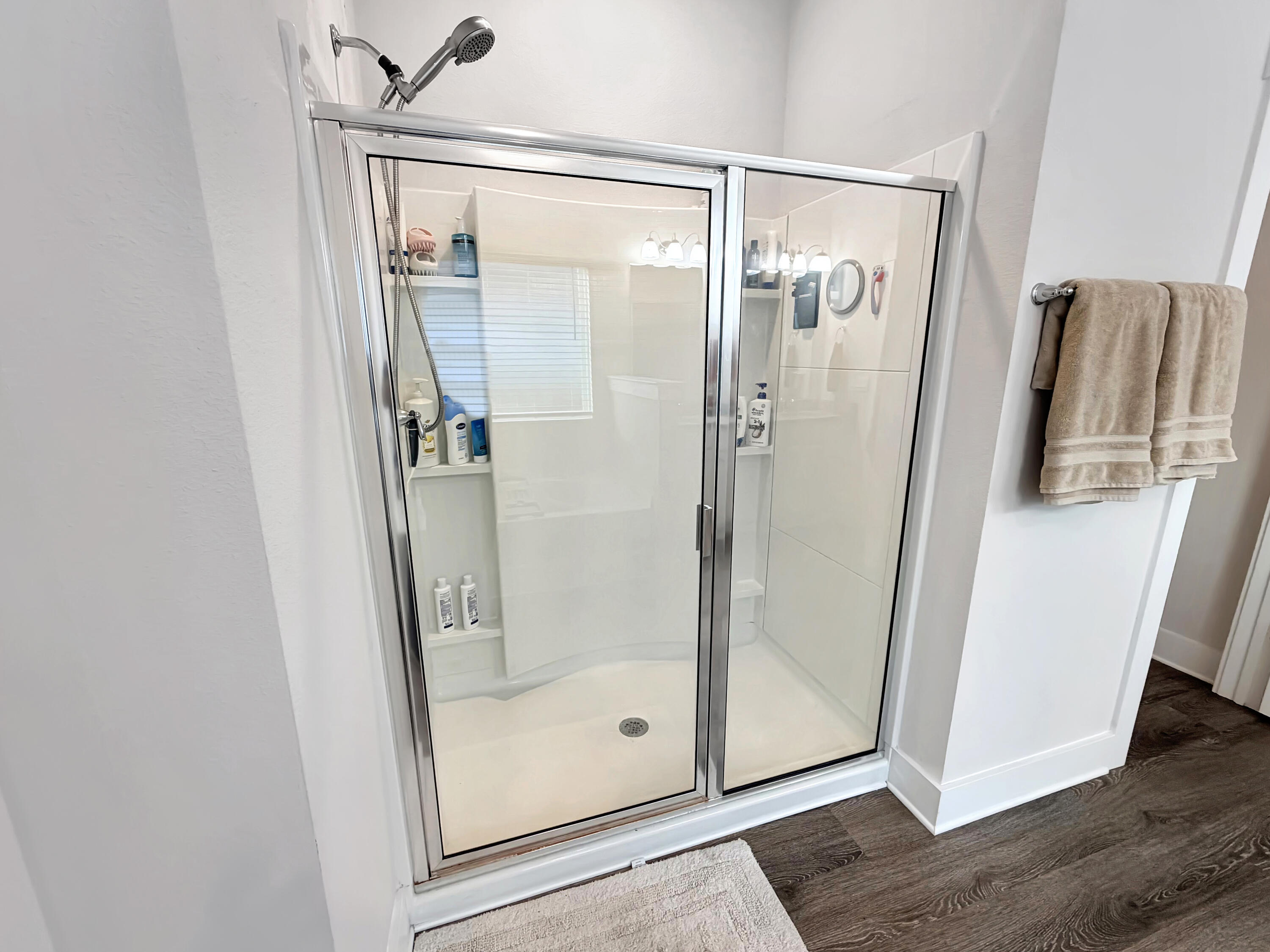 2456 Dakota Way Crestview, FL 32536 - Photo 27 of 38 a bathroom with a glass shower door and a glass door