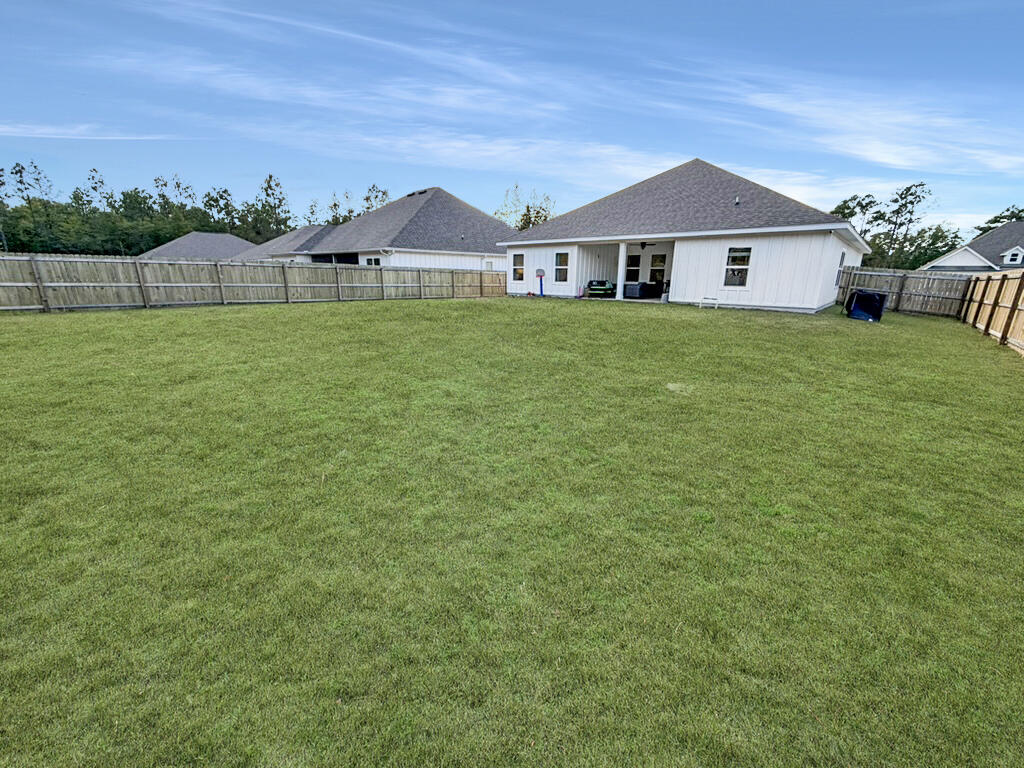 2456 Dakota Way Crestview, FL 32536 - Photo 32 of 38 a view of a house with a yard