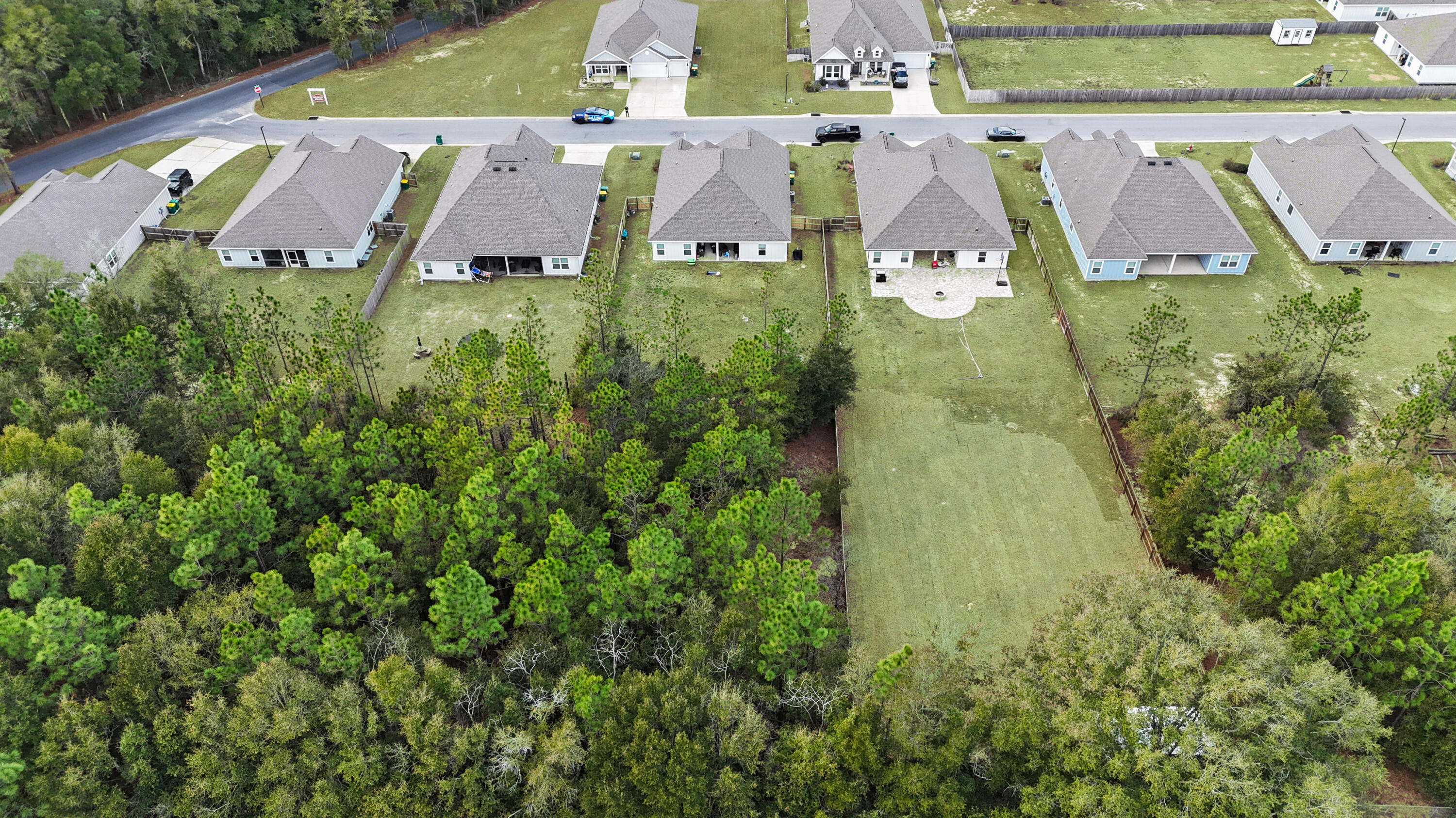 2456 Dakota Way Crestview, FL 32536 - Photo 38 of 38 an aerial view of residential houses with outdoor space and trees