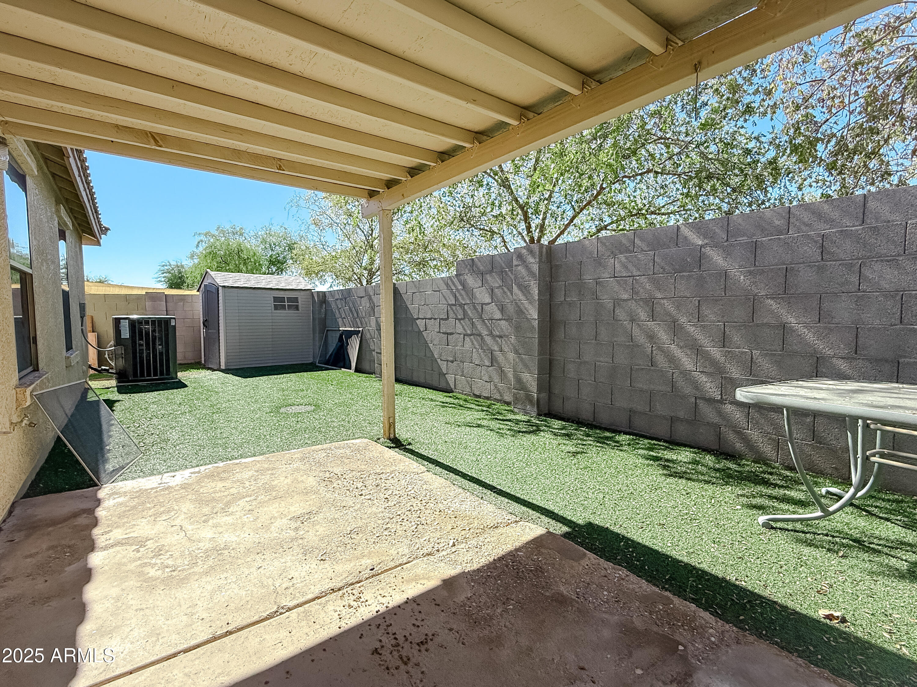 1042 South Clancy Circle Mesa, AZ 85208 - Photo 14 of 14 a view of a backyard with a small cabin
