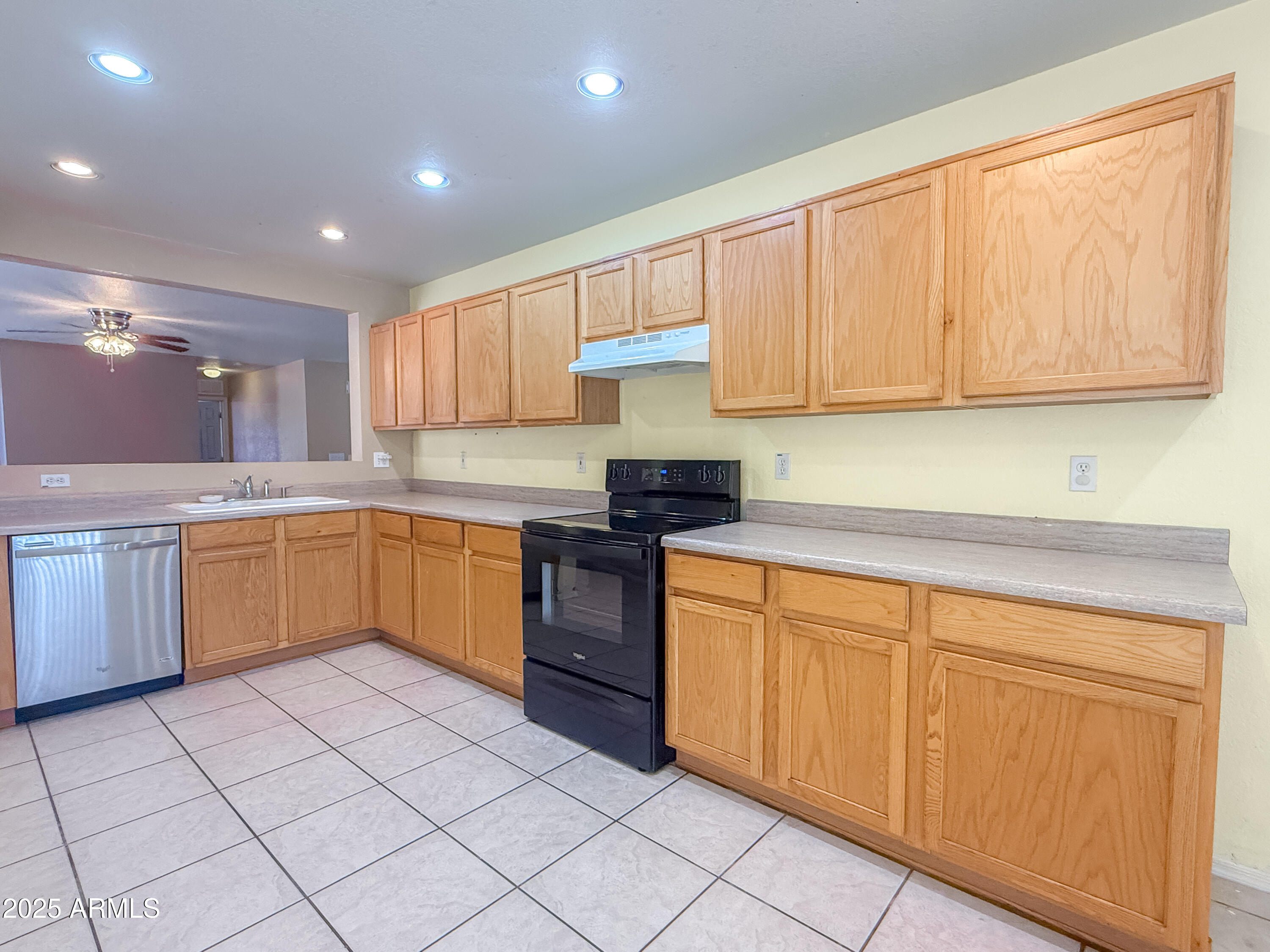 1042 South Clancy Circle Mesa, AZ 85208 - Photo 6 of 14 a kitchen with a sink window and cabinets
