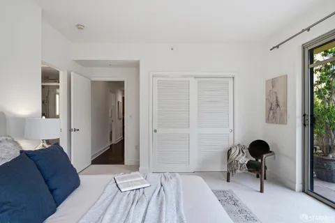 a lobby with furniture and a chandelier