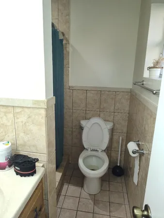 a bathroom with a toilet and a sink
