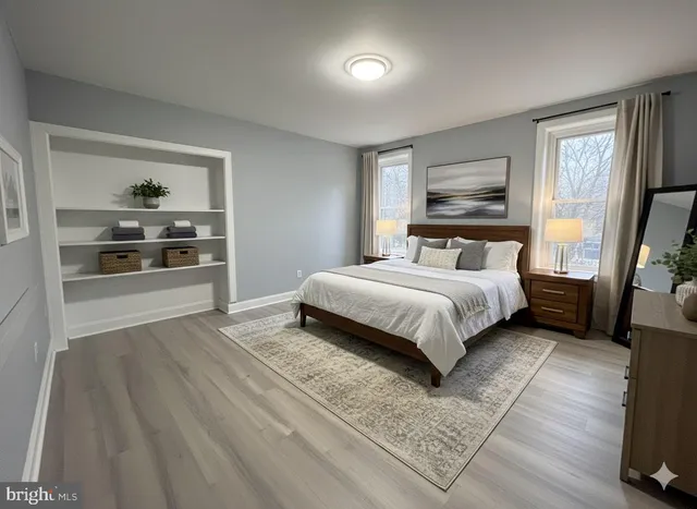 a bedroom with a bed and a couch