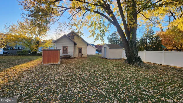 a house with a tree in front of it