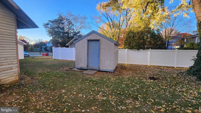 a view of a backyard with a tree
