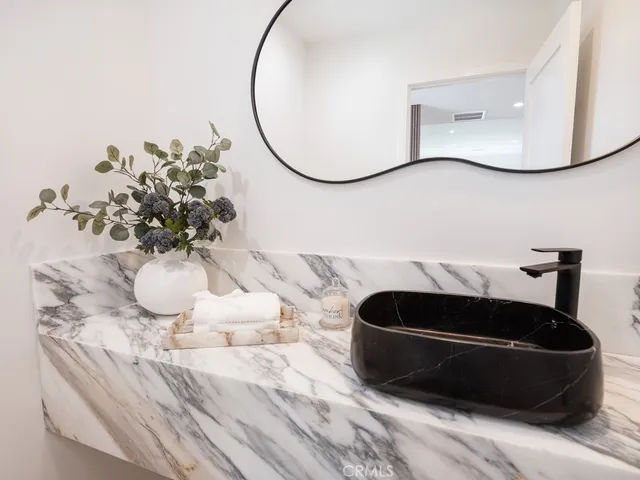 a bedroom with a large bed and a couch