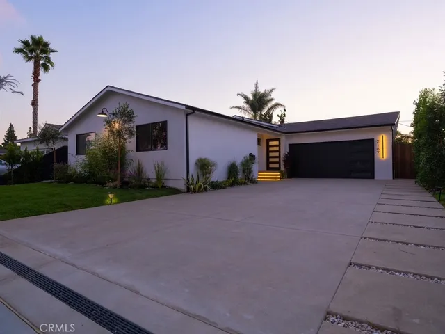 a view of a chair and table in backyard