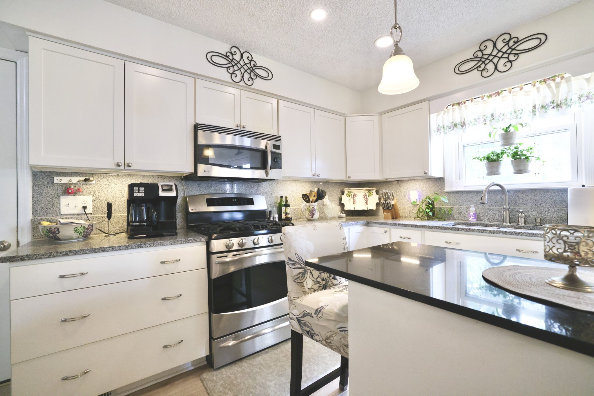 1809 Hidden Ridge Circle Mount Juliet, TN 37122 - Photo 14 of 45 a kitchen with stainless steel appliances granite countertop a sink a stove and cabinets