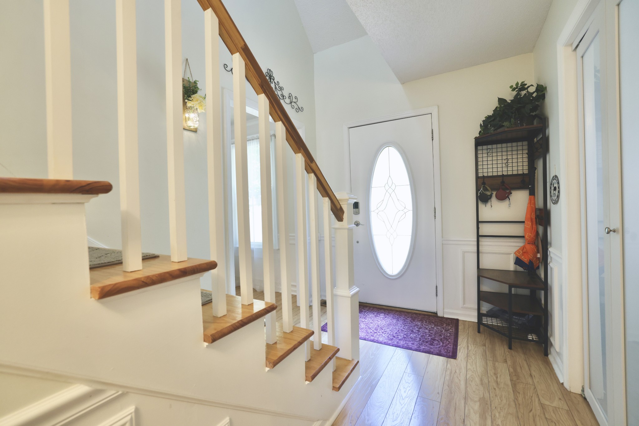 1809 Hidden Ridge Circle Mount Juliet, TN 37122 - Photo 19 of 45 a view of staircase with wooden floor and a potted plant