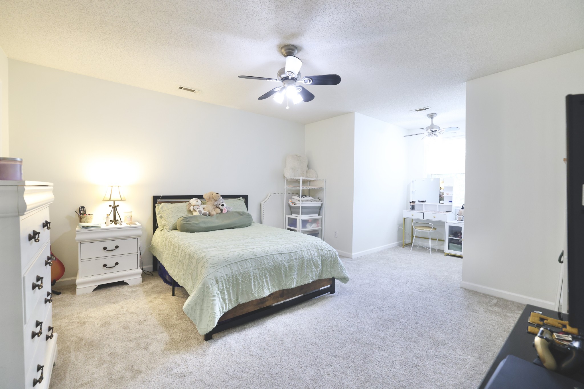 1809 Hidden Ridge Circle Mount Juliet, TN 37122 - Photo 27 of 45 a spacious bedroom with a bed and a chandelier