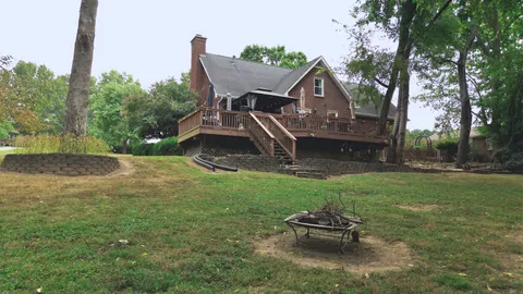a wooden bench sitting in the middle of a field