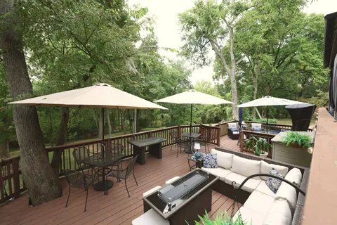 swimming pool view with a seating space