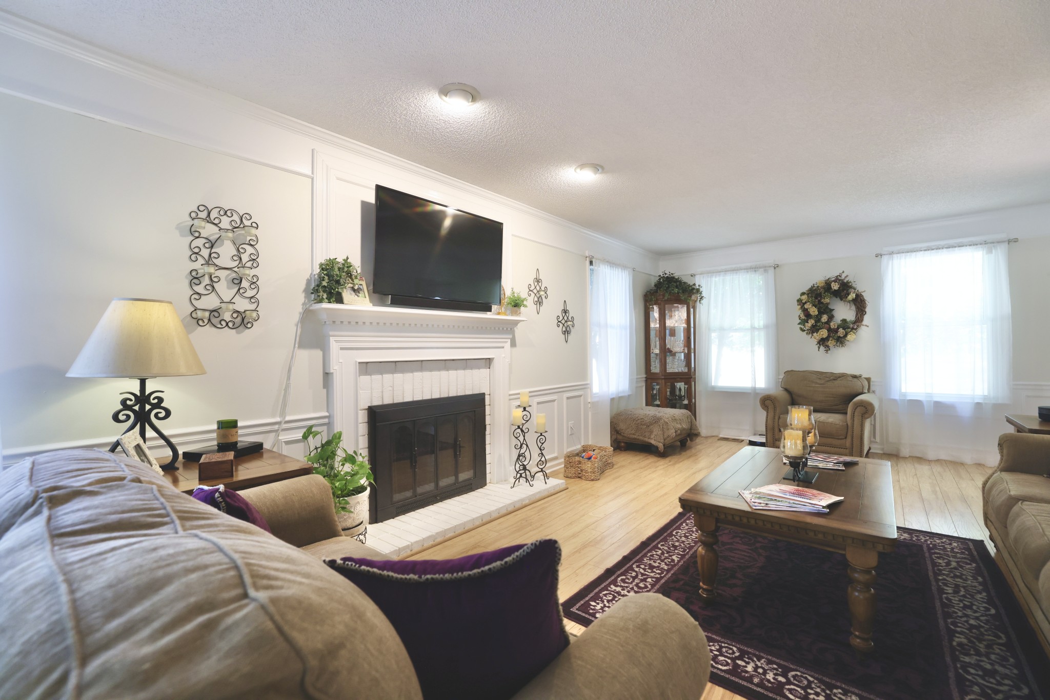 1809 Hidden Ridge Circle Mount Juliet, TN 37122 - Photo 6 of 45 a living room with furniture a fireplace and a flat screen tv