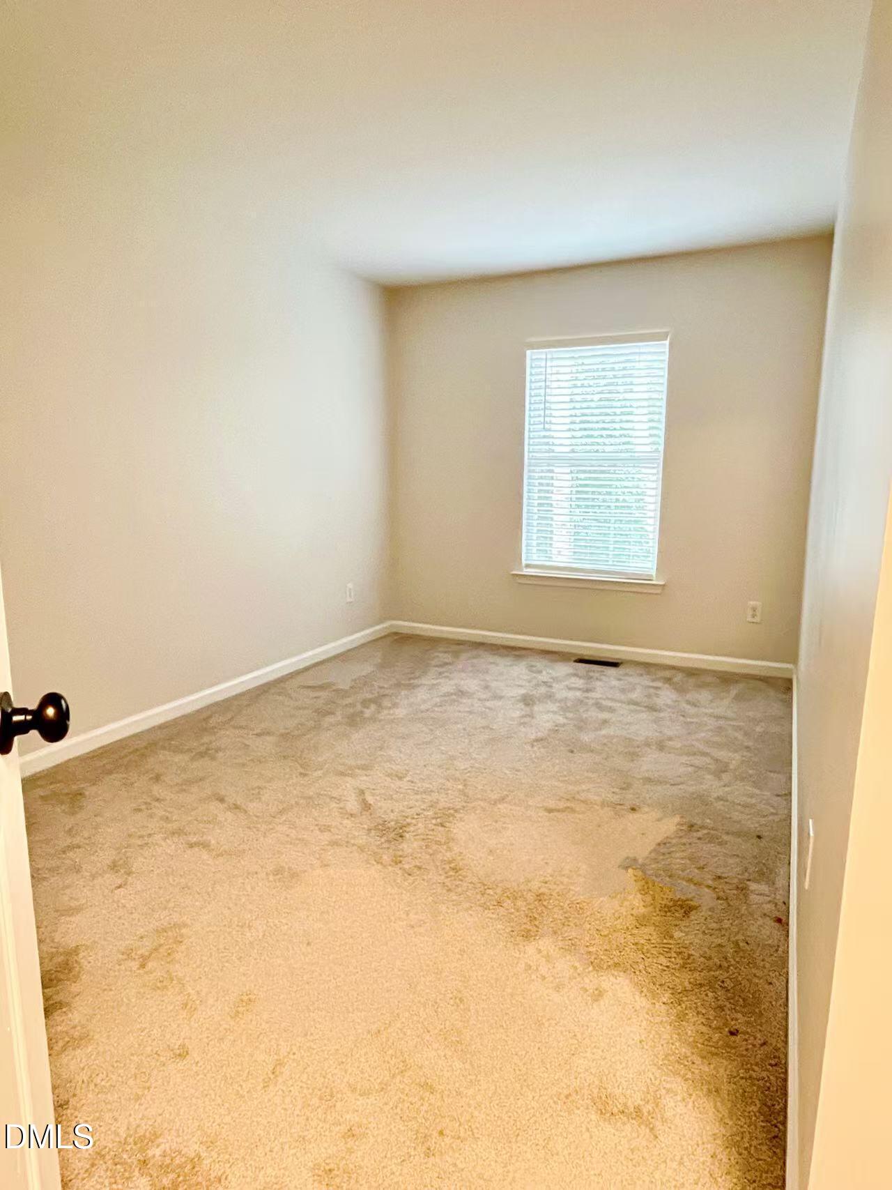 3040 Barrymore Street, Unit 108 Raleigh, NC 27603 - Photo 4 of 13 an empty room with a natural light
