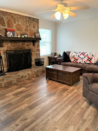 a living room with furniture and a fireplace