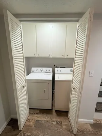 a utility room with a window dryer and washer