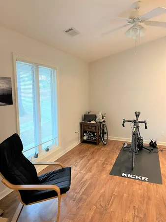 a bed room with a bed and a chair