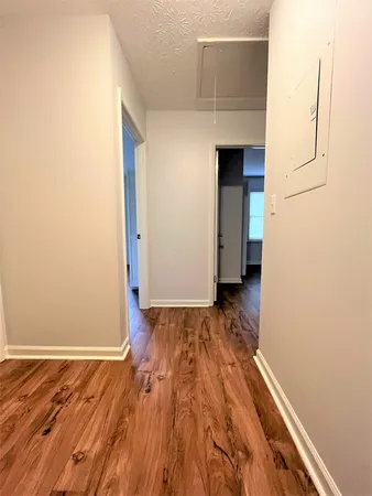 a view of a livingroom with wooden floor