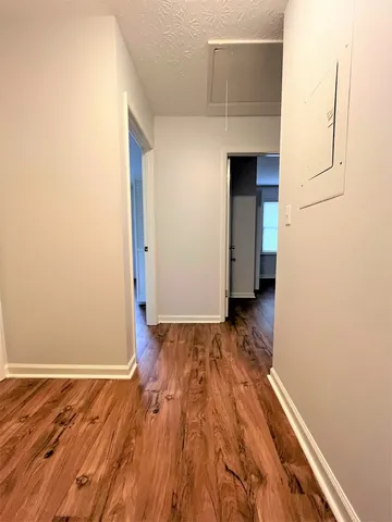 a view of a livingroom with wooden floor