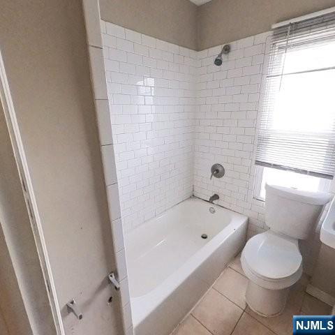 167 James Street Hackensack, NJ 07601 - Photo 24 of 30 a bathroom with a bathtub and toilet