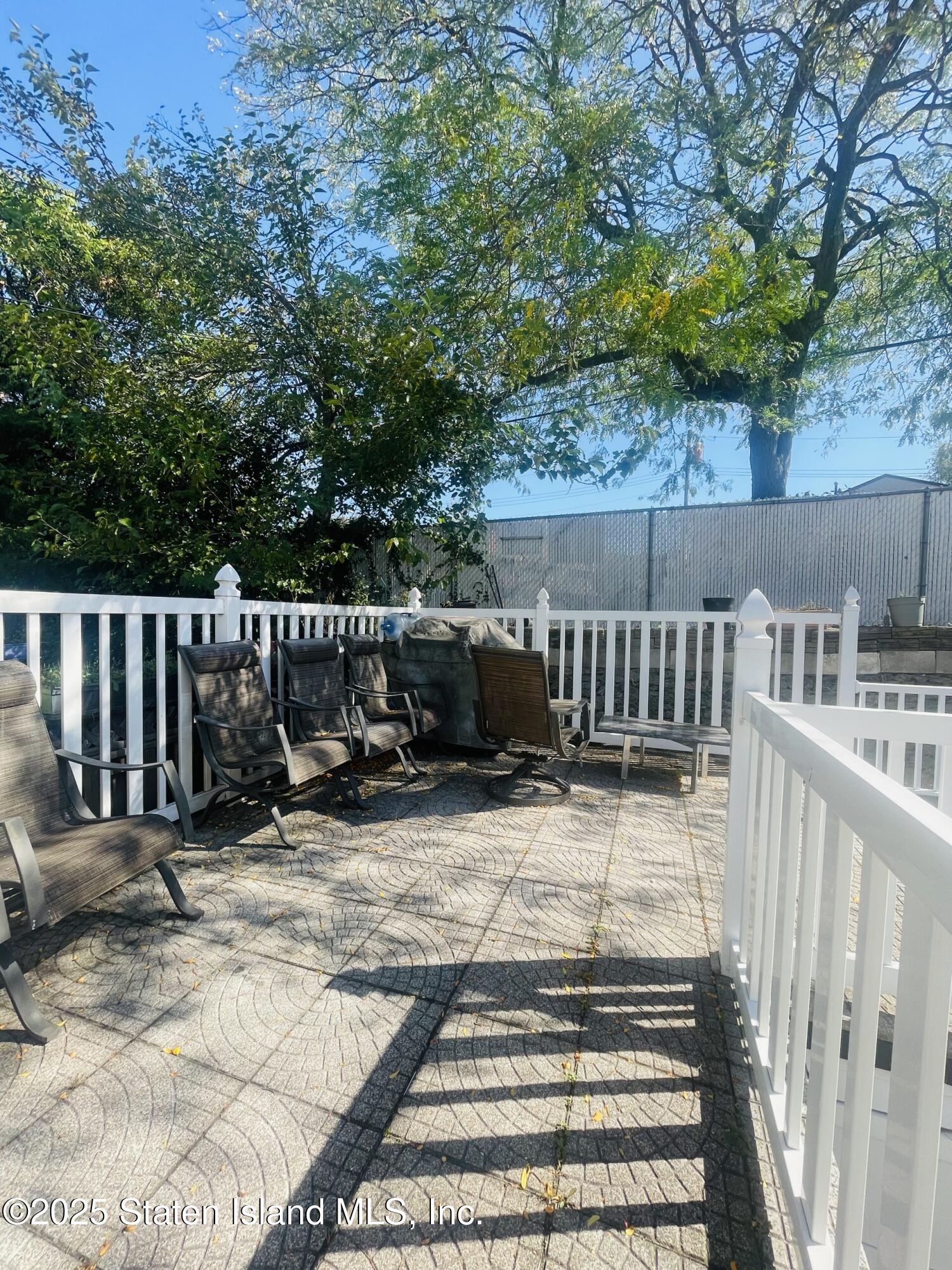 421 Hylan Boulevard Staten Island, NY 10305 - Photo 10 of 10 a view of backyard with deck and outdoor seating