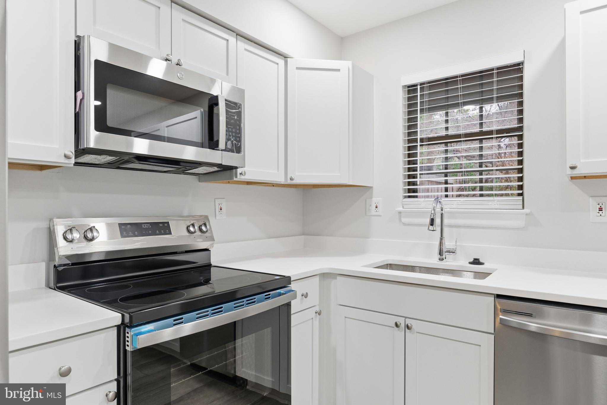 2006 Headlands Circle Reston, VA 20191 - Photo 13 of 29 a kitchen with a stove microwave and sink