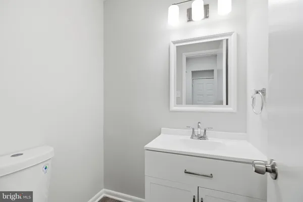 a bathroom with a sink a vanity and a mirror