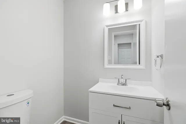 a bathroom with a sink a vanity and a mirror