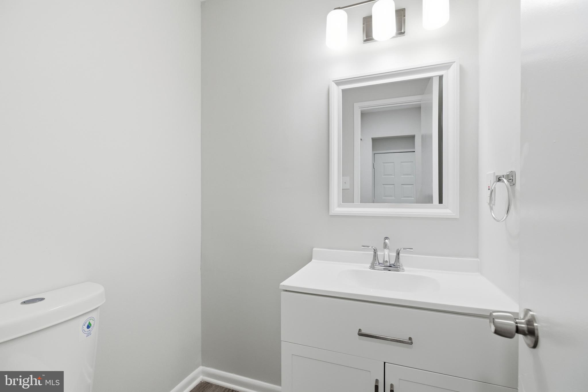 2006 Headlands Circle Reston, VA 20191 - Photo 15 of 29 a bathroom with a sink a vanity and a mirror