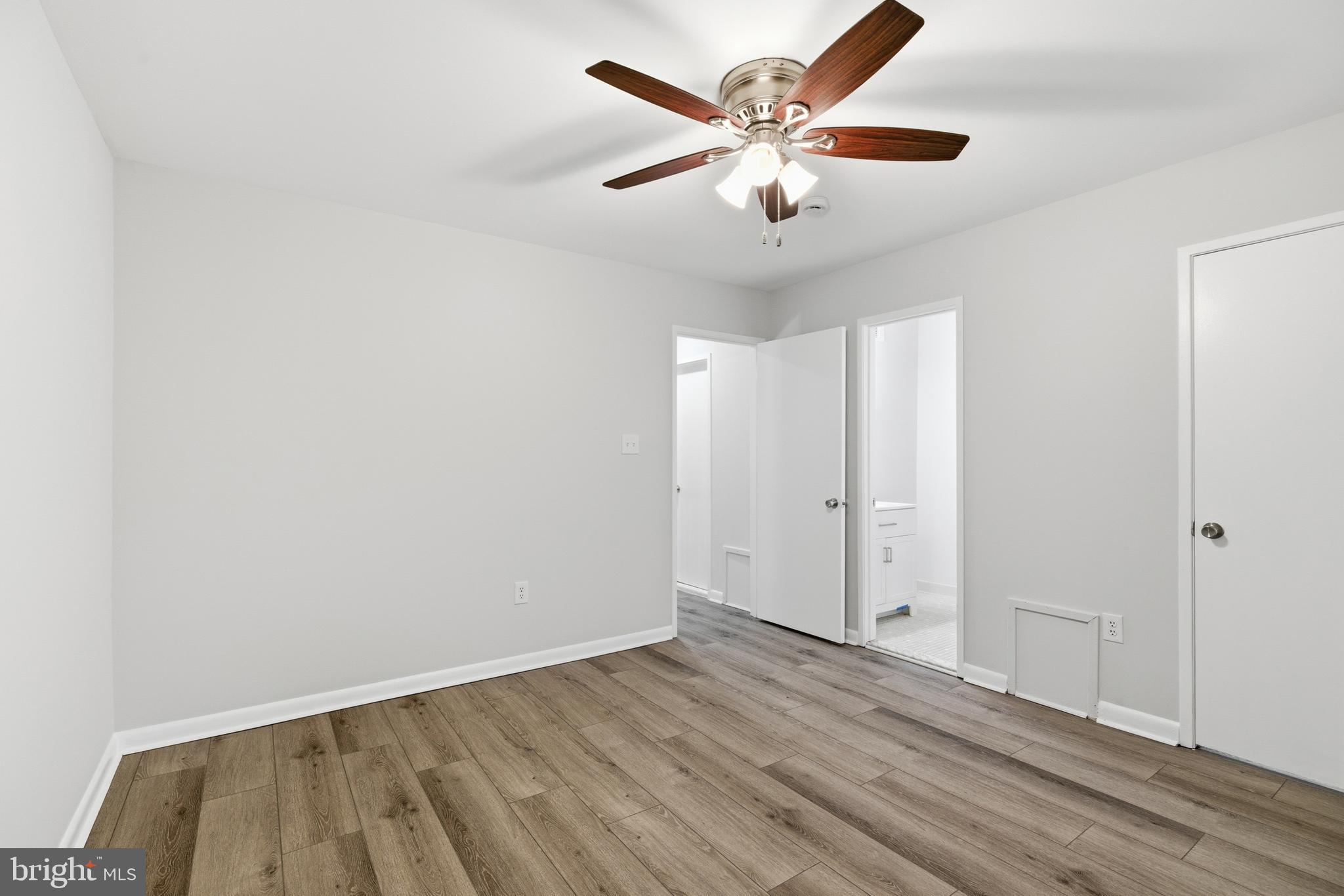 2006 Headlands Circle Reston, VA 20191 - Photo 19 of 29 an empty room with wooden floor and a ceiling fan