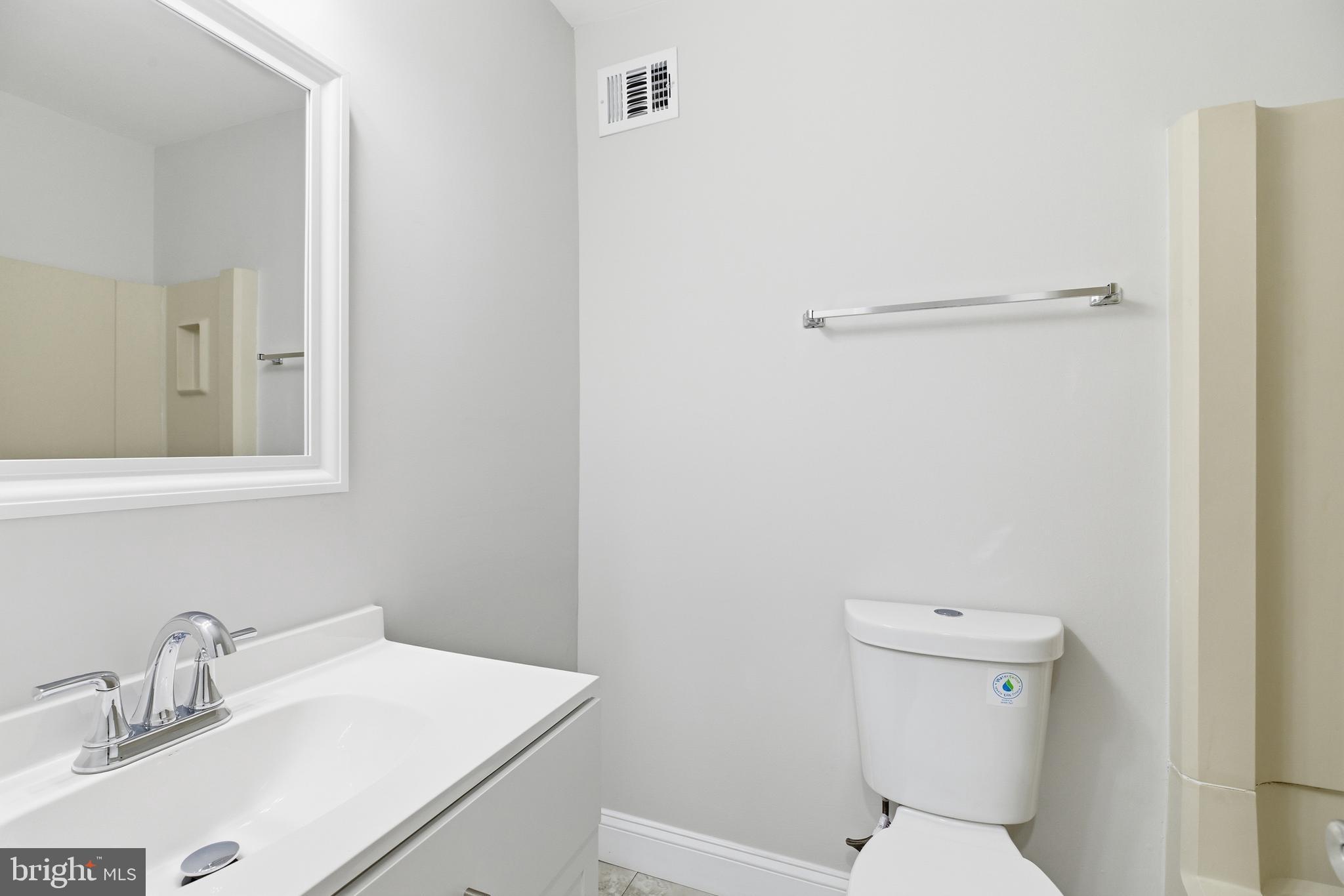 2006 Headlands Circle Reston, VA 20191 - Photo 26 of 29 a bathroom with a sink toilet and vanity
