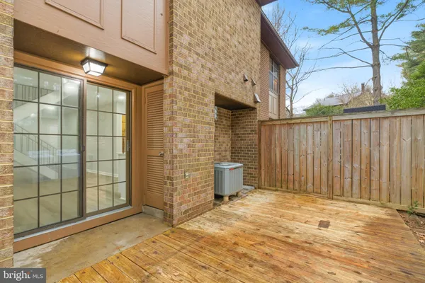 a view of a patio with table and chairs