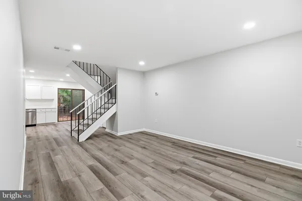a view of an entryway with wooden floor