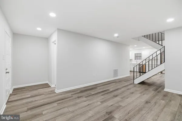 a view of an entryway with wooden floor