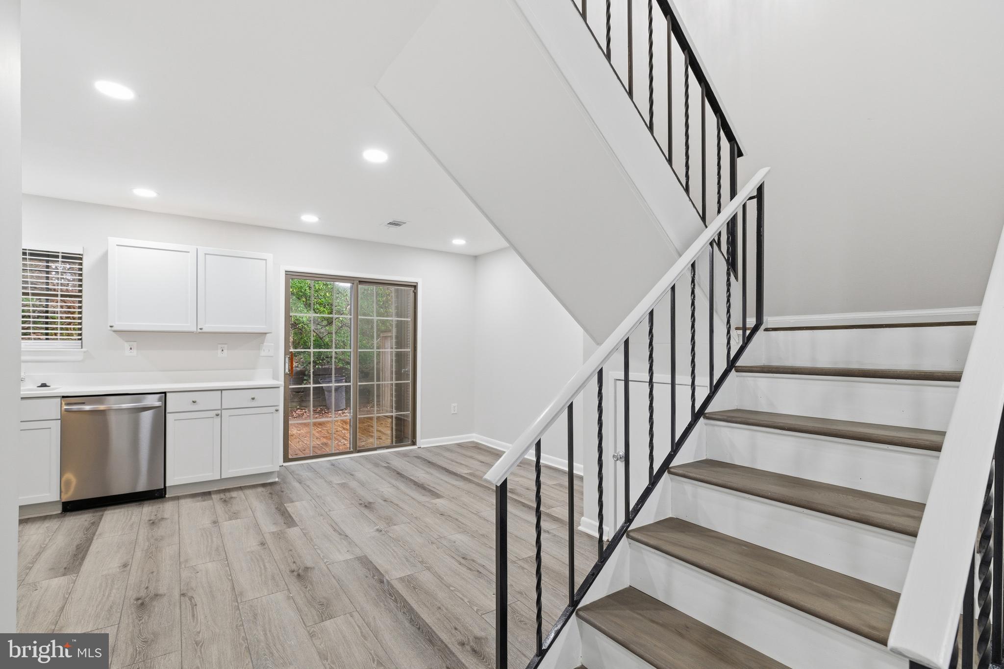 2006 Headlands Circle Reston, VA 20191 - Photo 8 of 29 a view of a kitchen with wooden floor and electronic appliances