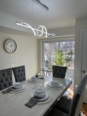 35 Fredonian Street, Unit K Shirley, MA 01464 - Photo 14 of 18 a view of a dining room with furniture window and wooden floor