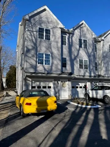 a view of a house with pool and sitting area